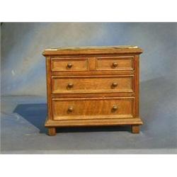 An oak "apprentice" chest of 3 long drawers raised on bracket feet 11" £50-75...