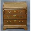 Image 1 : An 18th Century oak bureau the fall front revealing a fitted interior above 3 long graduated draw...