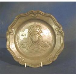 A circular embossed pewter plate with bracketed border and armorial decoration 9" £40-60...