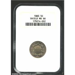 1883 5C MS66 NGC. Golden blue patina and virtually distraction free surfaces. Several die breaks are