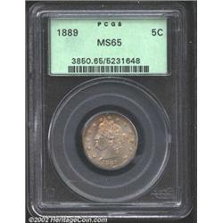 1889 5C MS65 PCGS. Light crimson wash over it's otherwise steel surfaces. A couple of small blemishe