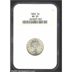 1892 5C MS65 NGC. Both sides have splashes of light gold patina. Lustrous with a good strike and cle