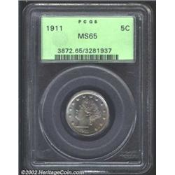 1911 5C MS65 PCGS. Gold and blue iridescence shimmer over the obverse while the reverse has just a f