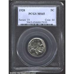 1928 5C MS65 PCGS. Icy blue patina with some flashes of orange. Some very slight orange peel texture