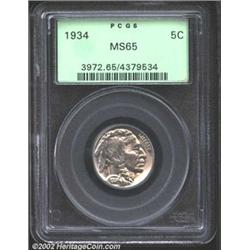 1934 5C MS65 PCGS. Lustrous with only a very slight warm cast. A few small wispy abrasions sit on th