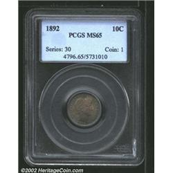 1892 10C MS65 PCGS. Richly toned with deep shades of green, gold, and lavender colors. A lustrous Ge