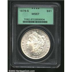 1879-S S$1 MS67 PCGS. The left reverse border has rich apricot, electric-blue, and peach patina. The