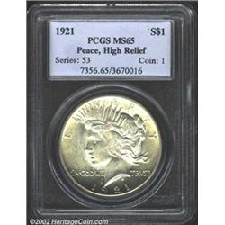 1921 S$1 MS65 PCGS. Scintillating mint frost with light golden toning and slight softness in the cen