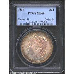 1884 S$1 MS66 PCGS. The golden-brown and rose-violet patina is gorgeous. Lustrous and well struck wi