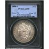 1884-S S$1 AU55 PCGS. A lightly abraded example that has wisps of golden-brown color on the margins.