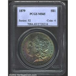 1879 S$1 MS65 PCGS. The obverse has rich sea-green, gold, and violet patina, while the reverse is es