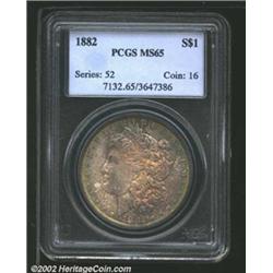 1882 S$1 MS65 PCGS. A lustrous Gem that has splendid sea-green and copper-gold patina. Well struck a