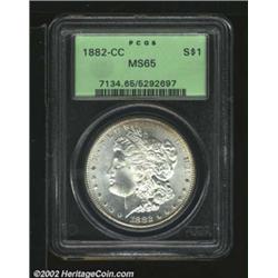 1882-CC S$1 MS65 PCGS. A flashy Gem that has hints of tobacco-brown color at the upper obverse borde