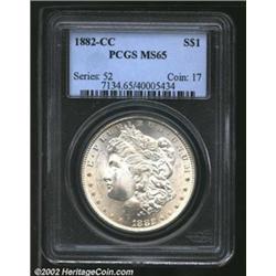 1882-CC S$1 MS65 PCGS. Glistening satiny luster with an overlay of light golden toning. The hair ove