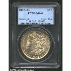 1882-O/S S$1 MS64 PCGS. The strike is nearly full and the reverse white with a golden toned obverse.