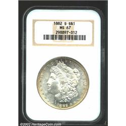 1882-S S$1 MS67 NGC. Superbly defined with blazing, satiny cartwheel luster and a touch of golden to