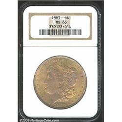 1883 S$1 MS66 NGC. The luminous dusky gold fields are accompanied by lavender tinged devices. A lust