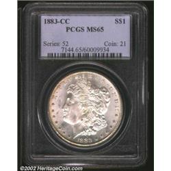1883-CC S$1 MS65 PCGS. The obverse border has a hint of gold color, while the reverse is brilliant..