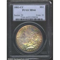 1883-CC S$1 MS66 PCGS. Dynamic gold, violet, powder-blue, and olive-green patina. There is a dash be