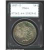1885-O S$1 MS64 PCGS. The obverse has intense yellow-green and aqua-blue patina, while the reverse i
