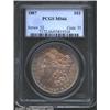 1887 S$1 MS66 PCGS. The obverse has bright orange and powder-blue patina, while the reverse has rich