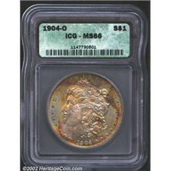 1904-O S$1 MS66 ICG. Multicolored obverse toning with a pure-white reverse. The hair over Liberty's.