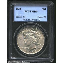 1934 S$1 MS65 PCGS. Nicely struck with golden patina and light contact marks in the left obverse fie