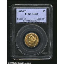 1892-CC $5 AU58 PCGS. A well struck coin with bright luster at the margins and crisp details on the.