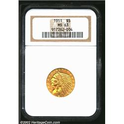 1911 $5 MS63 NGC. Portions of the recessed devices have honey-gold patina. A boldly struck, lustrous
