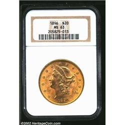 1896 $20 MS63 NGC. Rich, golden surfaces with nice luster and excellent strike. Some luster grazes o