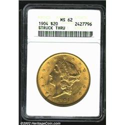 1904 $20 MS62 ANACS. Rich golden surfaces with frosty luster. Typical marks for the grade, as well a