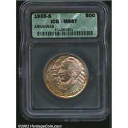 1935-S 50C Arkansas MS67 ICG. The obverse has speckled russet patina across rich sweeps of yellow-gr
