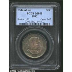 1892 50C Columbian MS65 PCGS. Light iridescent blue toning covers the obverse, and the reverse enjoy