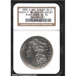 1898-S S$1 Silver Dollar--Struck on a Heavily Adjusted Planchet--AU50 NGC. The upper, lower, and lef