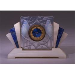 "Inseparables," a LALIQUE clock, circa 1926, in opalescent glass, fitted into an Art Deco blue an…