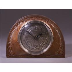 "Moineaux," a LALIQUE clock for ATO, circa 1924, in clear and frosted glass with sepia patina, or…