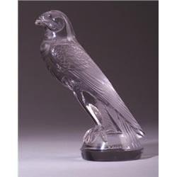 "Faucon," a LALIQUE automobile hood ornament, circa 1925, in clear and frosted glass. Molded R. L…