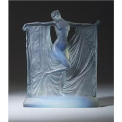 "Suzanne," a LALIQUE statuette, circa 1925, in opalescent glass with blue patina. Molded R. LALIQ…