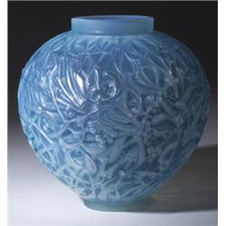 "Gui," a LALIQUE vase, circa 1920, in cased opalescent glass with blue patina. Molded R. LALIQUE,…