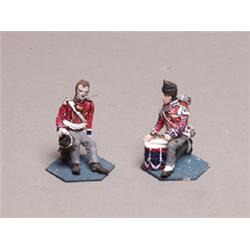 Two Painted Metal Seated Figures