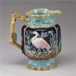 ENGLISH MAJOLICA stork jug, circa 1875, attributed to Joseph Holdcroft, patterned with storks and…