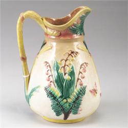 SAMUEL LEAR MAJOLICA jug, circa 1880, with lily-of-the-valley pattern and yellow rope handle on w…