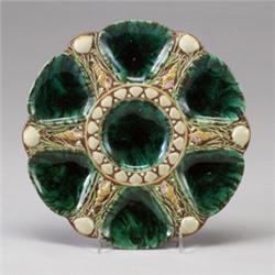 MINTONS MAJOLICA oyster plate, dated 1883, with six shell-form oyster wells, glazed in malachite …