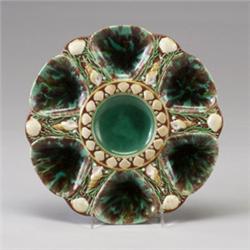 MINTON MAJOLICA oyster plate, dated 1870, with six shell-form oyster wells, glazed in tortoise sh…