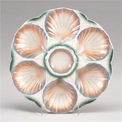 SARREGUEMINES MAJOLICA oyster plate, circa 1920, with six shell-form oyster wells, glazed in past…
