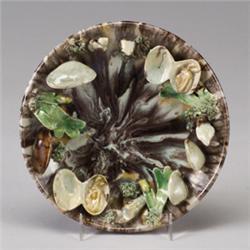 PORTUGUESE PINHEIRO PALISSY WARE charger, circa 1900, applied with naturalistically colored musse…