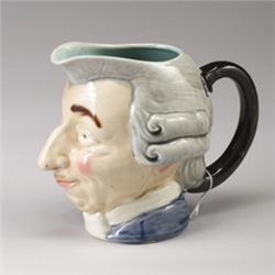 SARREGUEMINES MAJOLICA face jug, circa 1900, modeled as the head of a bewigged 18th Century gentl…
