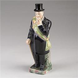 GERMAN MAJOLICA figural portrait bottle and stopper, circa 1895, modeled as the standing figure o…