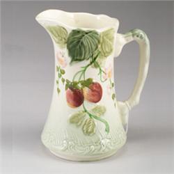 FRENCH CHOISY-LE-ROI MAJOLICA jug, circa 1910, patterned with strawberries in naturalistic colors…
