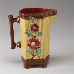 FRENCH MAJOLICA jug, circa 1900, decorated with flora on a yellow and brown ground. Impressed num…